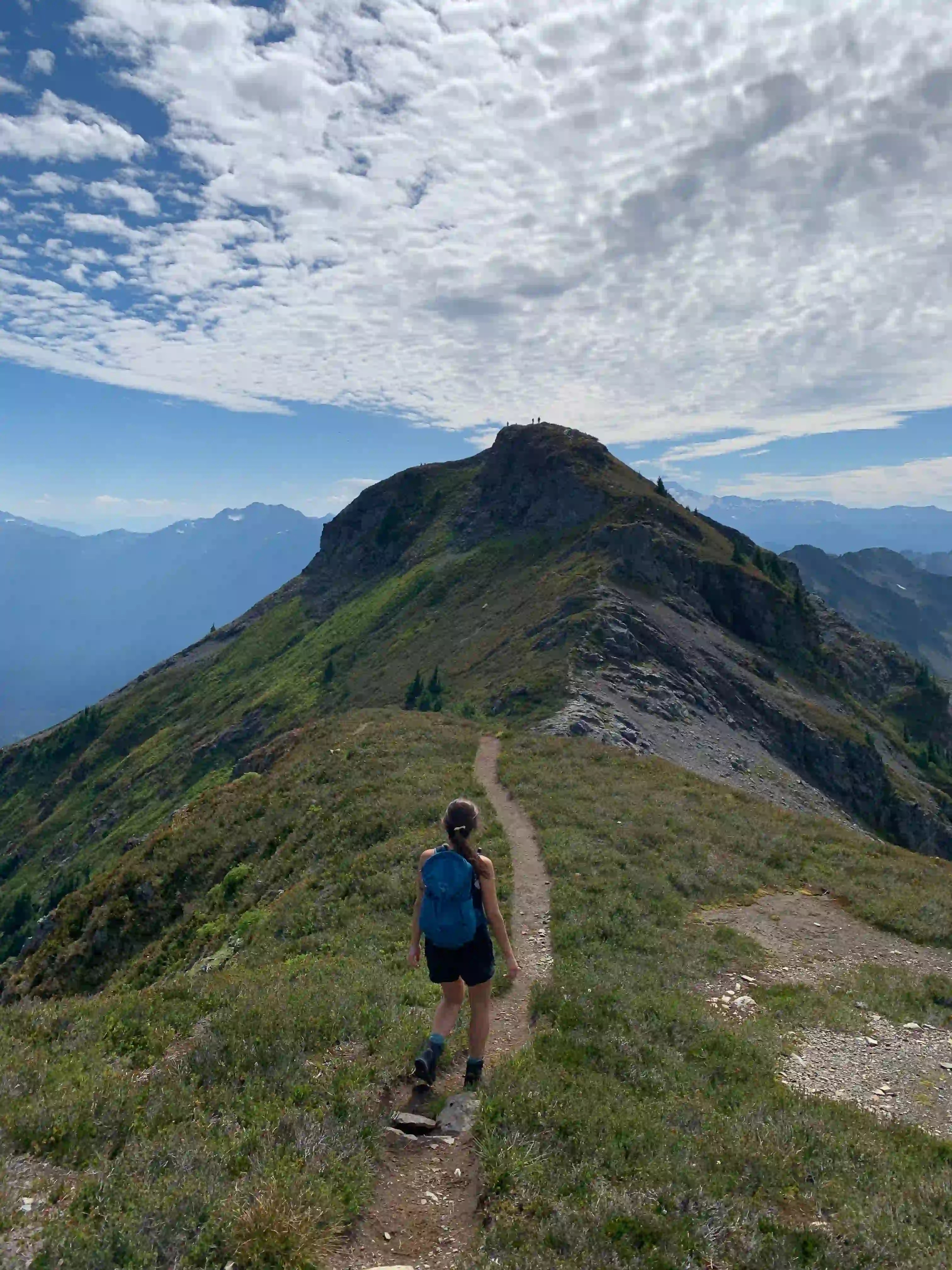 A woman hiking through the North Cascade mountains of Washington