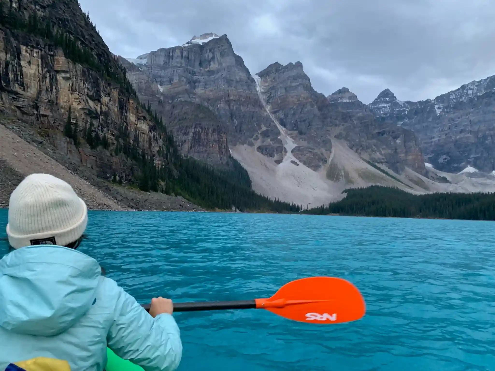Woman kayaking on Moraine Lake, Banff National Park, Canada
